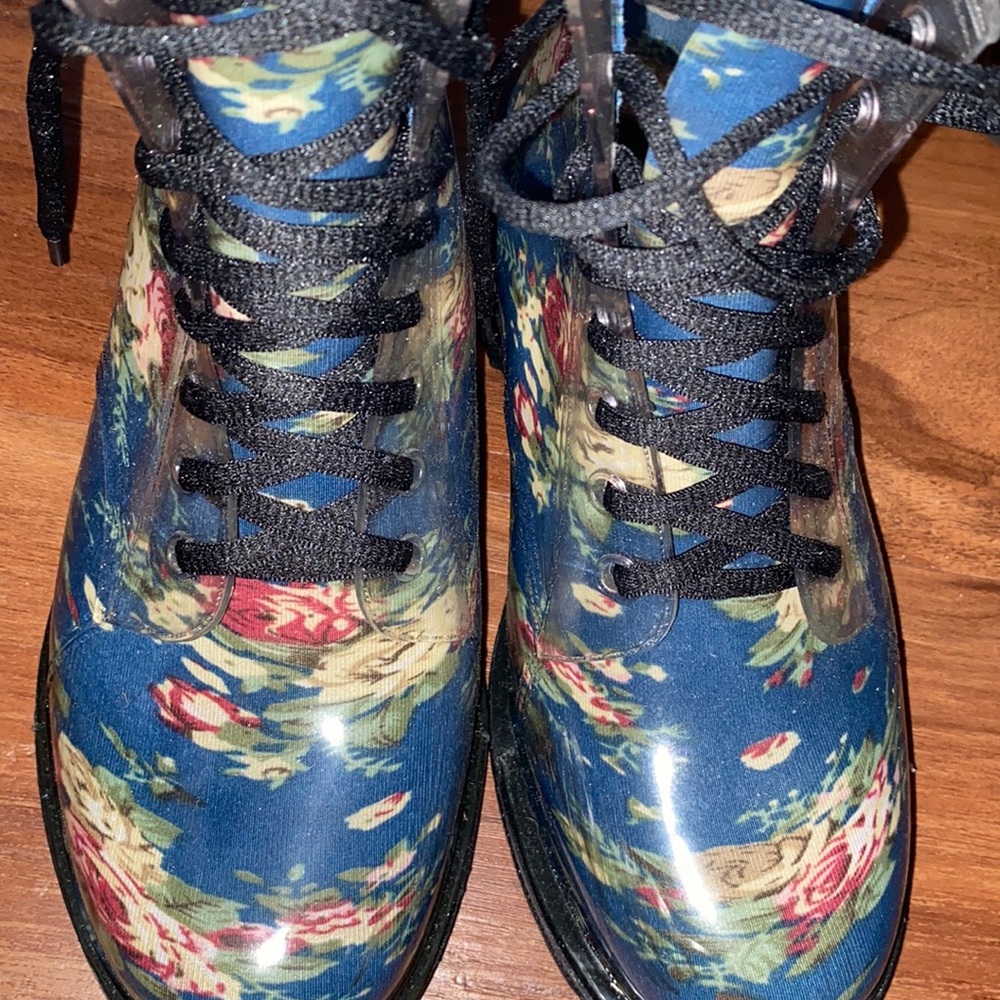 Women Rain boots with waves of flowers design.